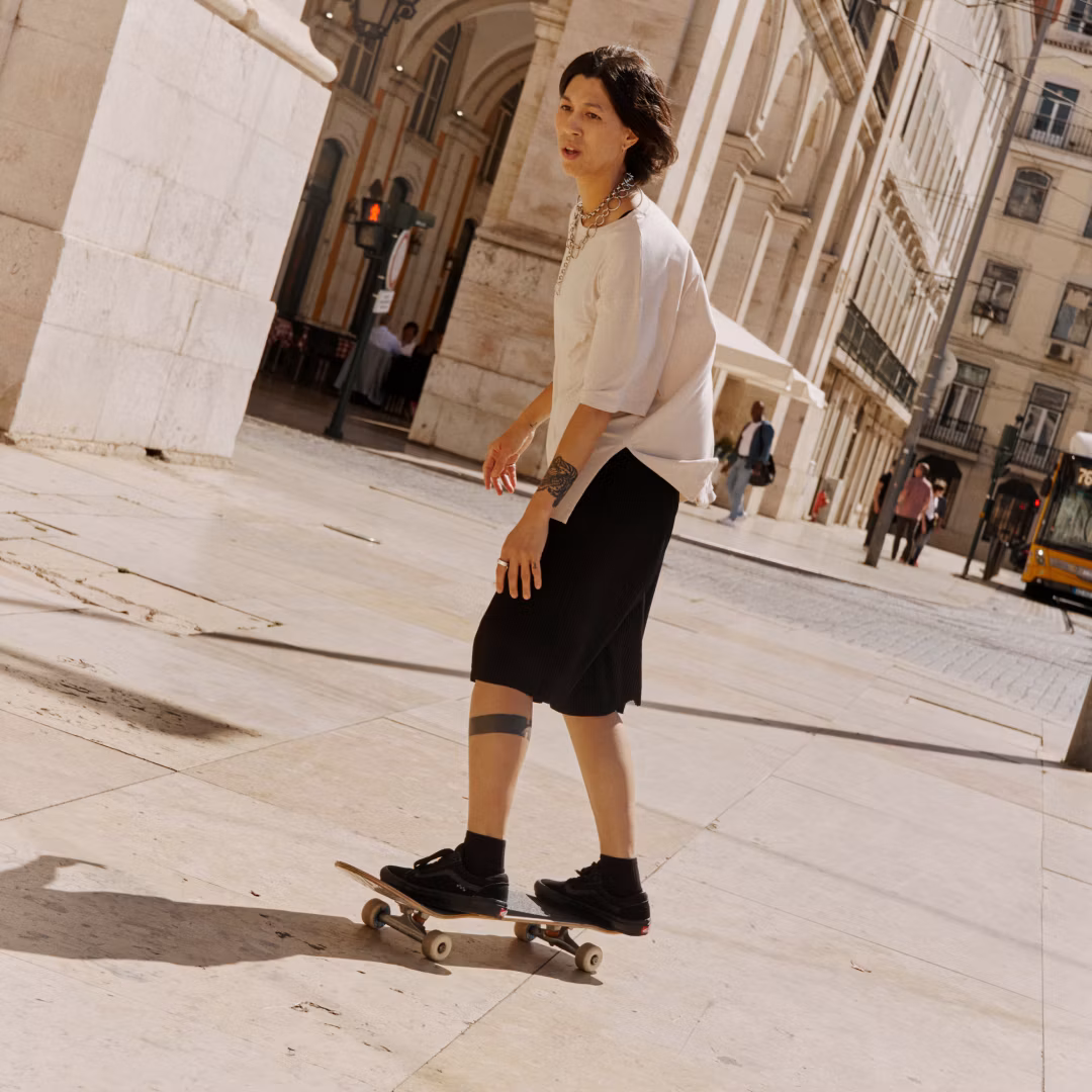 A young man skate boarding wearing an Oura Ring